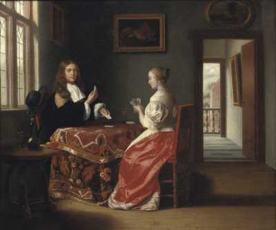 An Elegant Couple Playing Cards